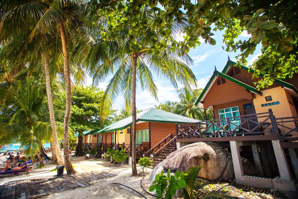Booking.com The shady coconut trees in front of the chalets are a great bonus!