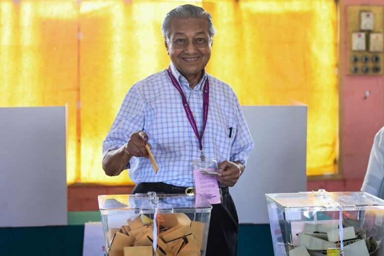 AFP via The Straits Times Tun Dr Mahathir casting his ballot during GE14.